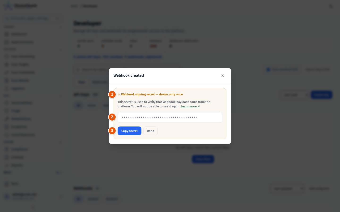 The Webhook created dialog with the signing secret shown once
